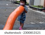 Small photo of Yogyakarta, Indonesia - nay 6 2023 ;girl playing in a park