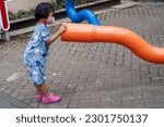 Small photo of Yogyakarta, Indonesia - nay 6 2023 ;girl playing in a park