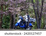 Small photo of NAN, THAILAND – JANUARY 17, 2024: Asian man standing with motorcycle on the high mountain in the morning at Khunsathan Watershed Research Station in Nan province of Thailand.Road trip by motorcycle.