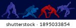 Sports freestyle wrestling. Colored silhouettes of wrestling athletes on a dark background
