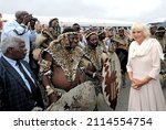 Small photo of Zulu Warriors in their traditional dress meet Prince Charles and the Duchess of Cornwall on the 22nd of July 2019 in Llanelwedd. the Royals were entertained by traditional war dance.