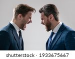Small photo of arguing businesspeople. dissatisfied men discuss failure. colleagues have disagreement conflict. shouting businessmen face to face. disrespect and contradiction. business partners blame each other.