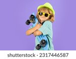 Small photo of Child with skateboard in the studio. Kid having fun with penny board. Penny board, skateboard for children. Longboard, skateboard or penny board concept.