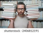 Small photo of Portrait of teacher in library classroom. Teachers in university library. Teachers Day. Funny teacher hold many books. Crazy teacher with books. Excited teacher in school book library.