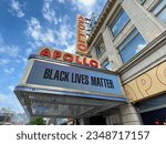Small photo of New York, NY USA - August 12, 2023 : Looking up view of the "Black Lives Matter" message on the Apollo Theater digital marquee sign on a summer day on 125th Street in Harlem, New York City, USA