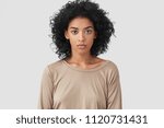 stock-photo-indoor-shot-of-serious-dark-skinned-female-freelancer-has-afro-hairstyle-pleasant-appearance-1120731431.jpg