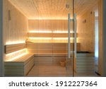 Front view of empty Finnish sauna room. Modern interior of wooden spa cabin with dry steam