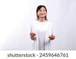 Happy asian woman standing...