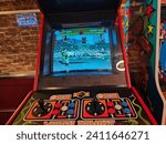 Small photo of Riverhead, NY, USA, November 24, 2023 - A closeup of a mortal kombat arcade machine.