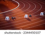 Small photo of Red Track with Precise White Lines and Sequential Numbers: A Visual Representation of Athletic Preparation and Precision - Track and Field Illustration Photo for Worlds in Budapest and Games in Paris