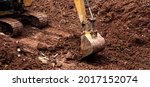 Small photo of The excavator performs excavation work on the construction site. Crawler excavator digs in shale layer, excavator. Earth-moving equipment, Excavator work