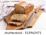 sliced traditional irish soda bread on a wooden board with bread knife