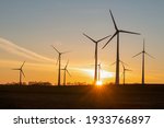 wind turbines in the rising sun
