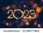 Happy New Year 2023. Beautiful holiday template web banner or billboard with Golden sparkling number 2023 on festive background with copy space for text