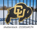 Small photo of Boulder, CO USA - January 24, 2022: Black and Gold CU Buffs logo outside on a practice field fence at the University of Colorado Boulder. Sunny day with snow on the ground.