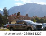 Small photo of Boulder, CO USA - September 29, 2023: Heisman trophy display at the University of Colorado Boulder. The Heisman House sponsored by Nissan. CU Buffs play USC at home Folsom Field. Football award.