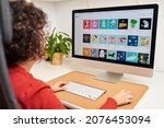 Woman buying NFT online on her desktop computer