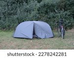 Pitched Tent And A Standing...