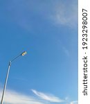 Small photo of negatif space lamp blue sky