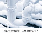Small photo of Plumbing sanitary white plastic sewer pipes siphons overflows for bathroom and sink.