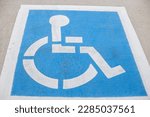 A white and blue reservation handicapped parking spot