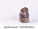 Glass jar filled with indian coins
