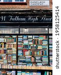 Small photo of LONDON, ENGLAND. Date of photo is 17.04.2021. Shop window displays the Hurlingham Books store close to Putney Bridge underground station in London. Fulham High Road.