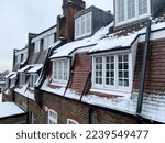 Small photo of London, UK - 12.12.2022. View of lookalike Parisian rooftops from Holy mount in Hampstead, Camden, North London, England, UK. Winter in London, Snow, snowing in London. Hampstead is an affluent reside