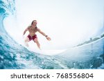 Small photo of Young surfer rides the perfect tropical ocean wave. Extreme sport and active lifestyle concept. Surfspot named Jailbreak, Maldives