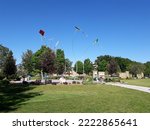 Small photo of Boise, Idaho USA - May 28 2017: Kinetic Sculpture by Artist Mark Baltes, Consisting of Five Independently Flying Kites Above the Entrance to the Bloch Plaza in Julia Davis Park