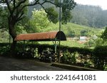 Small photo of Ooty, Tamilnadu, India- December 4, 2022: Parking area for the workers in Chamraj tea factory located on the main road via ooty to coonoor