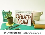 Hand writing sign Order Now. Business concept confirmed request by one party to another to buy sell Tidy Workspace Setup Writing Desk Tools And Equipment Taking Notes