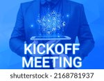 Small photo of Handwriting text Kickoff Meeting. Business approach Special discussion on the legalities involved in the project Man holding Screen Of Mobile Phone Showing The Futuristic Technology.