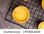 Small photo of The egg tart is a kind of custard tart found in Cantonese cuisine derived from the English custard tart and Portuguese pastel de nata. Egg tarts are often served at dim sum restaurants and cha chaan