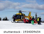 Small photo of Pilsko, Hala Miziowa, Poland - February 26, 2021: Rescue operation of GOPR Beskidy and HEMS Ratownik 4, with the use of an air ambulance helicopter.