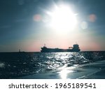 Ships on sea during sunset