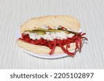 Small photo of A sandwich is a food typically consisting of vegetables, sliced cheese, or meat, placed on or between slices of bread, or more generally any dish wherein bread serves as a container