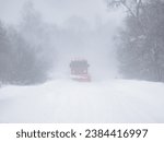 Winter landscape. A snowplow clears a snow-covered road. Bieszczady Mountains. Poland