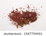 Small photo of This is a photograph of a Burgundy,Metallic Bronze,and Burnt Umber Powder Eyeshadow isolated on a White Background