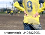 Muddy football field with muddy ...