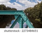 Steel structure of the bridge on the hydrotechnical facility in Wrocław, water structure, riveted structure, steel beams on the river weir