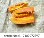 Small photo of untidy and imprecise pieces of ripe papaya