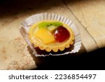 Small photo of Mini fruit pie is one of the favorite snacks in various events. A savory and tender pie, mingled with sweet cream, and healthy fresh fruits.
