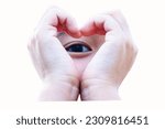 Small photo of Kids' hands making heart shape isolated on white background. With blurry eyes. Symbol of love and tender bonding of children. classic of love romance, talk about infatuation or may refer to friendship