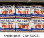 Small photo of Houston, Texas, USA - February 22, 2022: Mrs Baird's Whole Grain White Bread 20 oz loaves on the shelf in a supermarket.