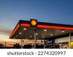 Small photo of Irving, Texas, USA - March 20, 2022: A Shell gas station at dusk. Shell Oil Company is an affiliate of the Royal Dutch Shell plc, a global group of energy and petrochemical companies.