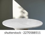 Marble table with window shadow drop on white wall background for mockup product display