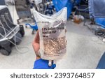 Small photo of Chicago, IL, USA, November, 27, 2023, hospital IV bags with lactated ringers and saline solution, medical fluids hanging on a stand in a sterile environment