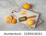 Grated lemon zest, on a cutting board, with a grater , top view, no people,