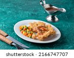 Small photo of Chicken fried steak, also known as country-fried steak or CFS, is consisting of a piece of beefsteak coated with seasoned flour and either deep-fried or pan-fried. Served with blackpaper sauce